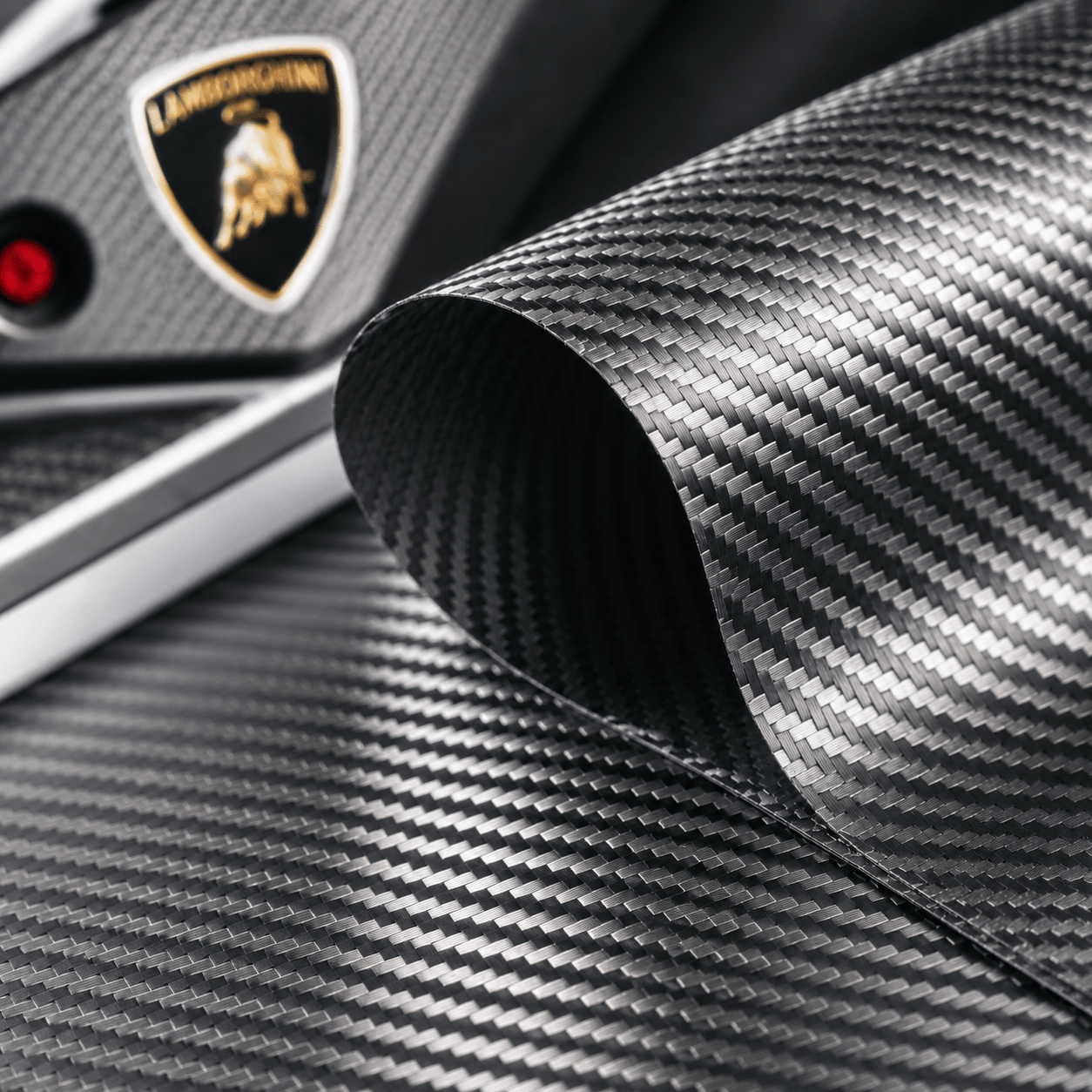 Carbon fiber texture with luxury automotive inspiration, showcasing the advanced composite material used in Formula 1, supercars and high-end design.