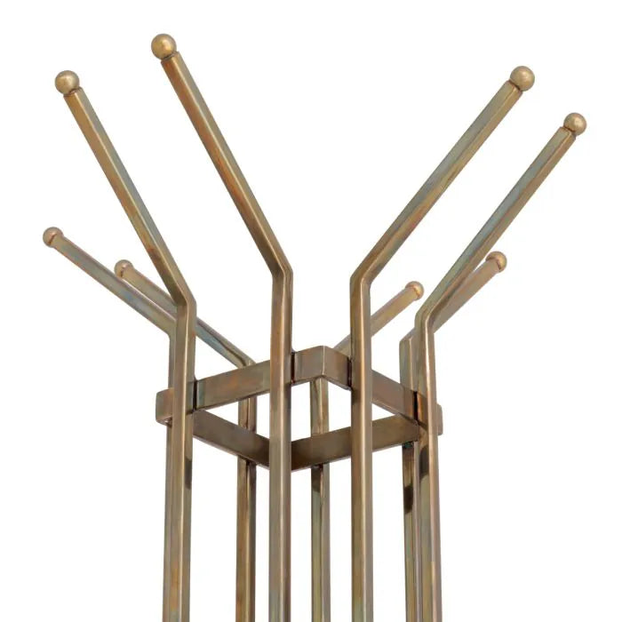 Volterra Coat Rack – elegant designer coat stand in brass finish, modern sculptural hallway furniture for luxury entryways, stylish freestanding coat hanger for contemporary interiors.