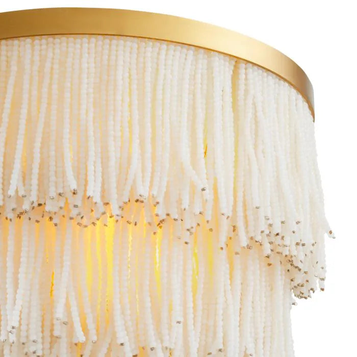 Eichholtz Wall Lamp Rosaline in vintage brass with three tiers of cascading white glass beads, luxury designer wall light