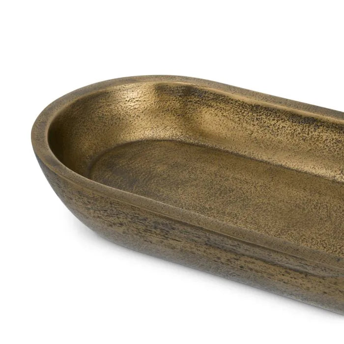 Eichholtz Bowl Hulton hand-cast in aluminium with rich antique brass finish, featuring an elongated oval shape with softly curved edges