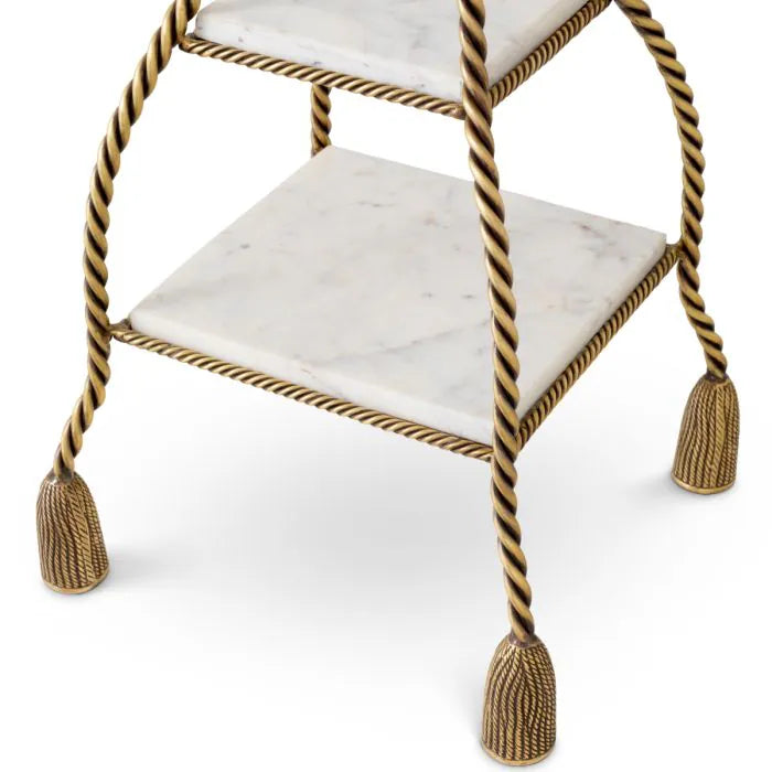Eichholtz Cake Stand Vanelle with two white marble shelves, twisted vintage brass frame and decorative tassel-inspired feet