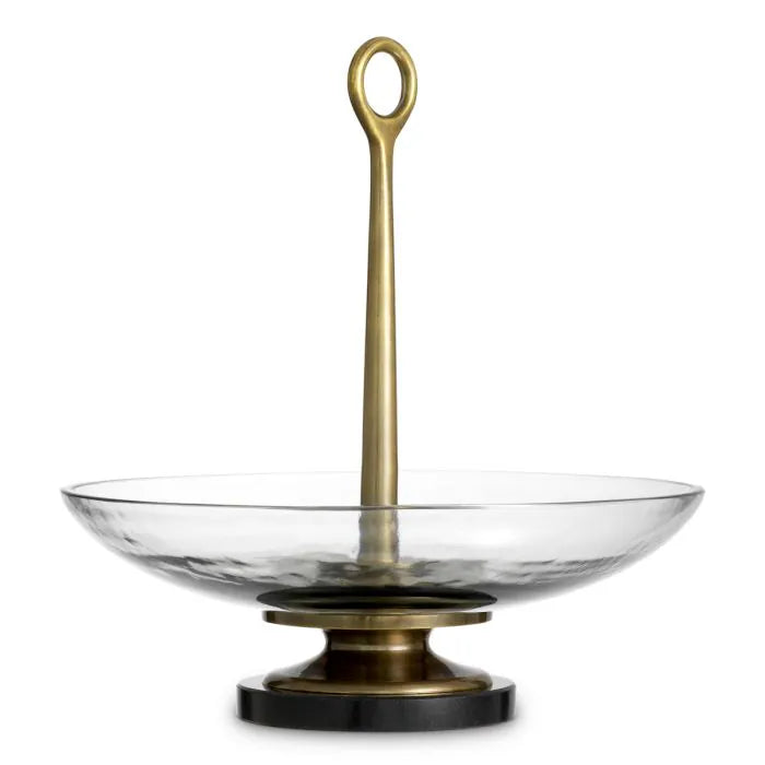 Eichholtz Bowl Opio in clear glass with vintage brass-finished stem and black granite base, luxury decorative centerpiece