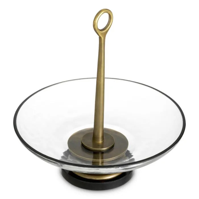 Eichholtz Bowl Opio in clear glass with vintage brass-finished stem and black granite base, luxury decorative centerpiece