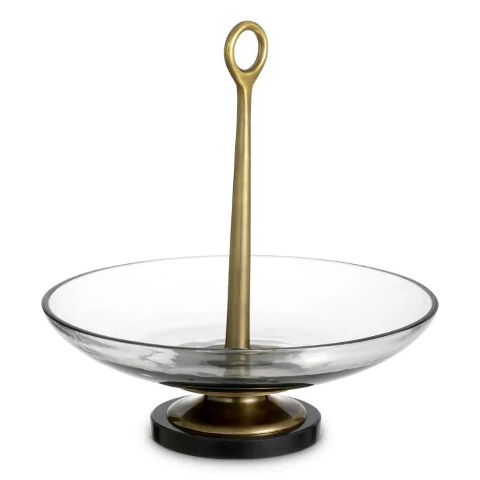 Eichholtz Bowl Opio in clear glass with vintage brass-finished stem and black granite base, luxury decorative centerpiece