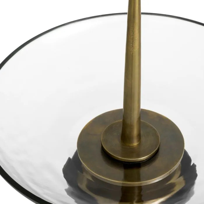 Eichholtz Bowl Opio in clear glass with vintage brass-finished stem and black granite base, luxury decorative centerpiece