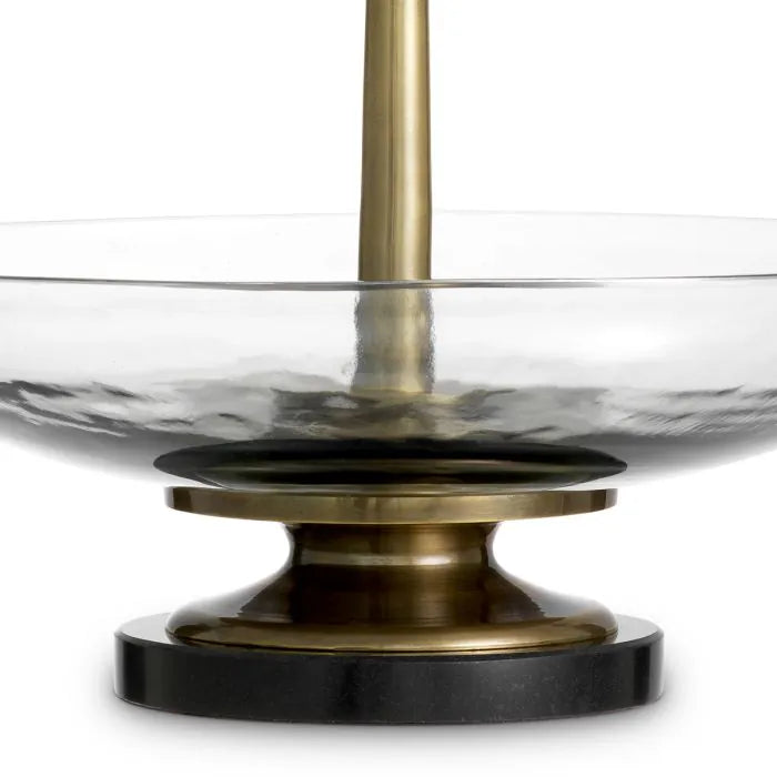 Eichholtz Bowl Opio in clear glass with vintage brass-finished stem and black granite base, luxury decorative centerpiece