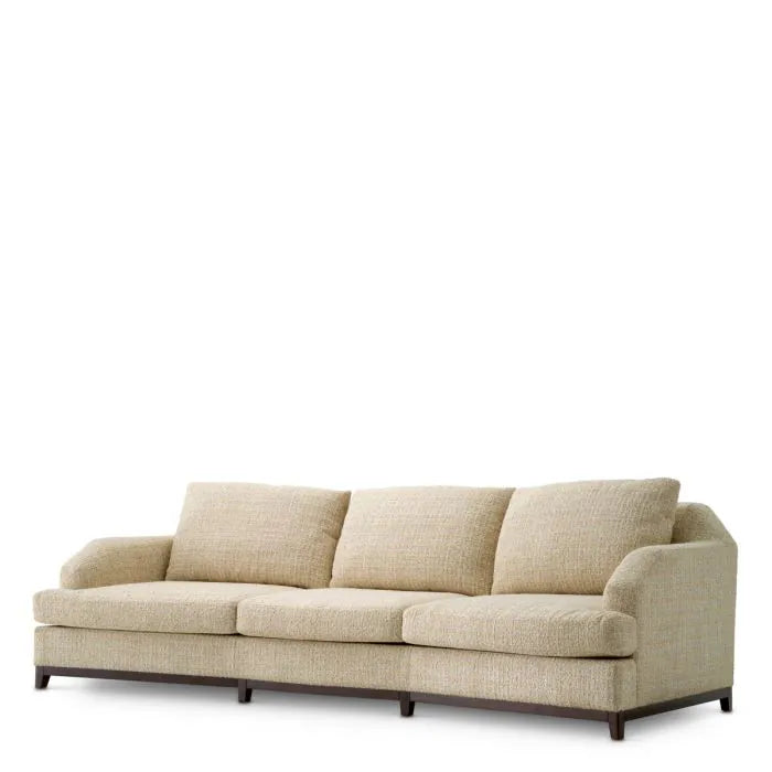 Eichholtz Sofa Vestry three-seater upholstered in beige Winslow chenille with curved arms, deep cushions and mahogany-finish base