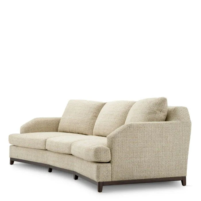 Eichholtz Sofa Vestry three-seater upholstered in beige Winslow chenille with curved arms, deep cushions and mahogany-finish base